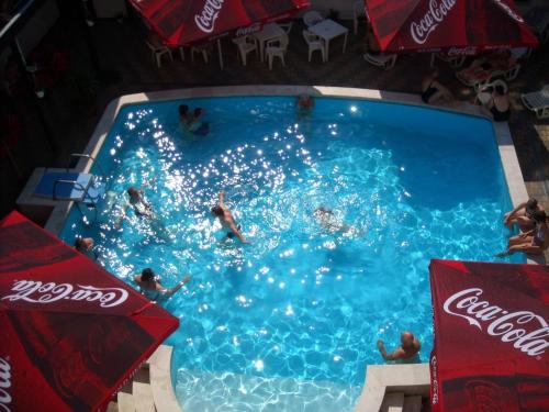 a group of people swimming in a swimming pool at Park Hotel Gyula in Gyula