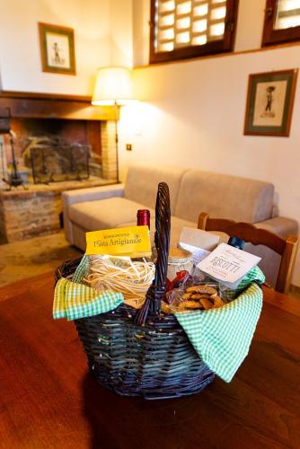 a basket sitting on a table in a living room at Podere Mezzastrada - Place of Charme in Fiano