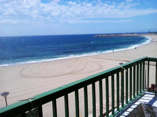 a view of the beach from a balcony at 2 bedrooms apartement with sea view shared pool and furnished balcony at Aguilas in Águilas