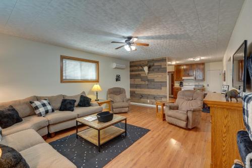 a living room with a couch and a table at Badlands Suite Less Than 1 Mi to Teddy Roosevelt Park! in Medora