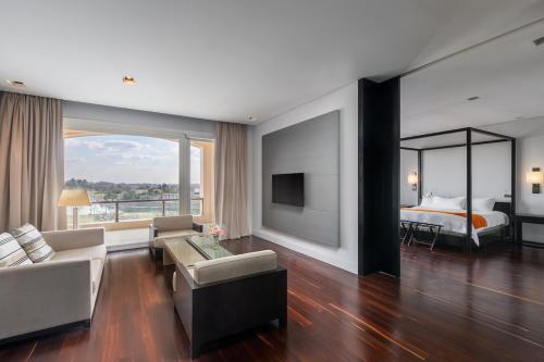 Ένα ή περισσότερα κρεβάτια σε δωμάτιο στο Sofitel La Reserva Cardales