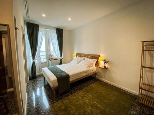 a small bedroom with a bed and a window at Taffetà b&b in Crispiano