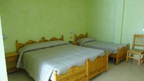 Ein Bett oder Betten in einem Zimmer der Unterkunft Albergo Nazionale