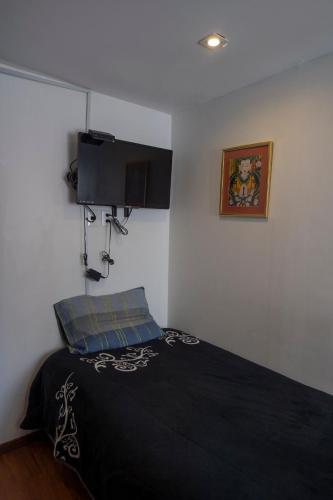 Ένα ή περισσότερα κρεβάτια σε δωμάτιο στο Casa Tanimisha