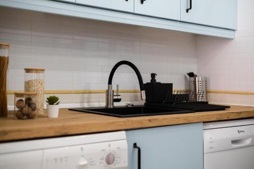 a kitchen with a sink and a counter top at Nordik Apartments Village - Torrox "Tønsberg" in Torrox Costa