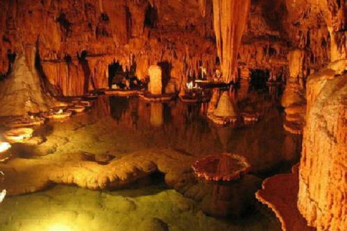 a cave with a pool of water in it at Tskaltubo Plaza Hotel in Tskaltubo