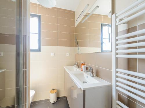 a bathroom with a sink and a shower at Maison Angoulins, 4 pièces, 6 personnes - FR-1-535-45 in Angoulins