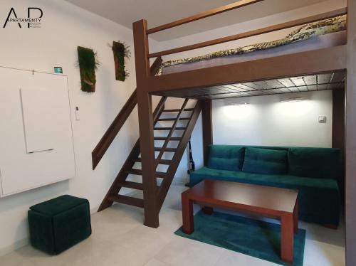 a living room with a bunk bed and a couch at Apartament przy Kościele in Połczyn-Zdrój