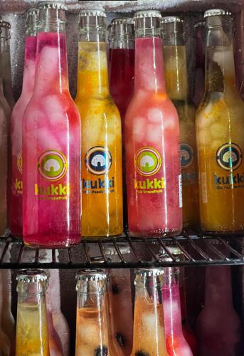 a group of bottles of drinks on a shelf at Hotel Wappenhof in Braunlage