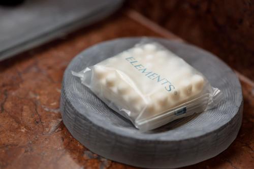 a piece of cheese on a plate on a table at Camino Real Pedregal Mexico in Mexico City