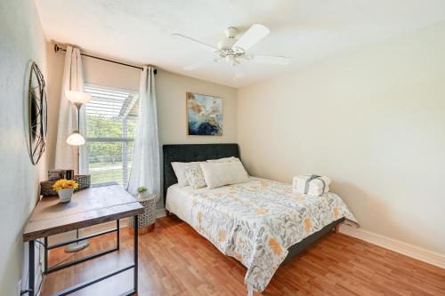a bedroom with a bed and a window at Pet-Friendly Naples Vacation Rental with Fire Pit! in Naples