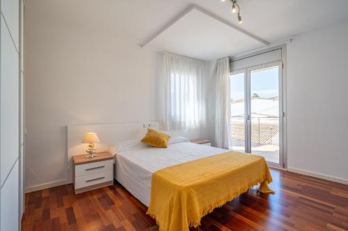 Posteľ alebo postele v izbe v ubytovaní Apartamento Luciana