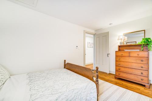 a bedroom with a bed and a wooden dresser at Hot Tub and Lake Access at Poconos Getaway! in Lake Ariel