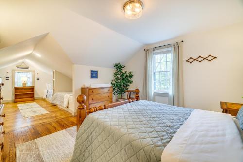 a bedroom with a bed and a large window at Hot Tub and Lake Access at Poconos Getaway! in Lake Ariel