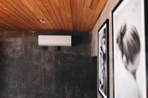 a light on a wall in a room at Naked Hotel Zipolite -Adults Only- in Zipolite