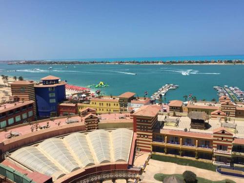 an overhead view of a baseball stadium and the water at بورتو مارينا in El Alamein