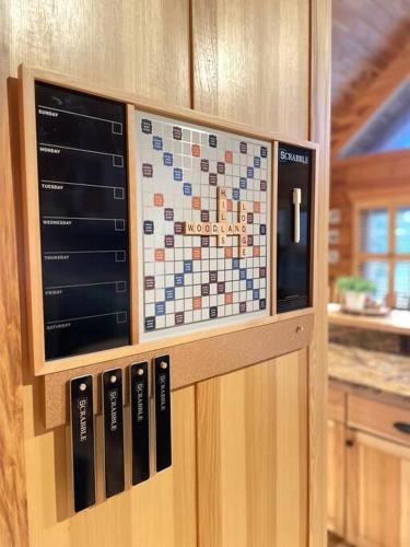a boardgame on a cabinet in a kitchen at Fully Stocked Cabin Retreat w/ Game Room & Pond! in Marion
