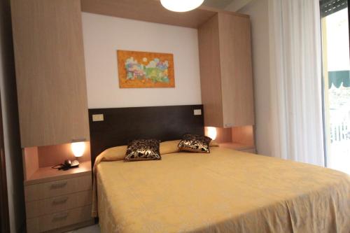 Letto o letti in una camera di Hotel Dei Tigli