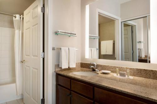 a bathroom with a sink and a mirror at Residence Inn Baltimore White Marsh in Baltimore