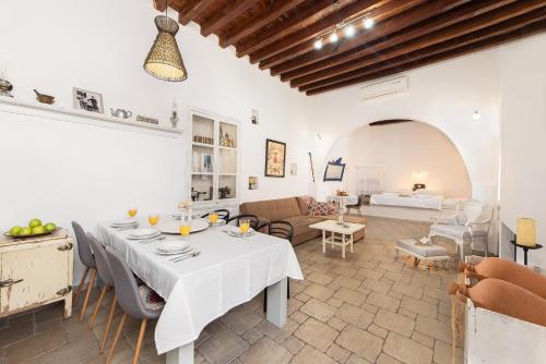 a living room with a table and a couch at Villa Kleanthi in Lardos