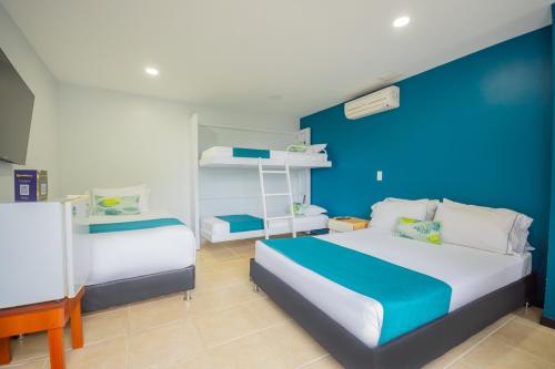 Postel nebo postele na pokoji v ubytování Greenview Medellin By St Hoteles