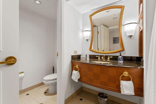 a bathroom with a sink and a mirror at Boardwalk 2BR 3BA Condo CozySuites at Showboat in Atlantic City