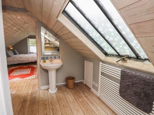 a bathroom with a sink and a window at Lower Calbourne Mill in Yarmouth