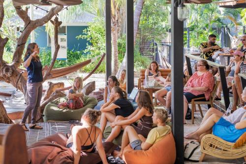 a group of people sitting in chairs in a room at Bounce Magnetic Island and Koala Park - formerly Roamer in Horseshoe Bay