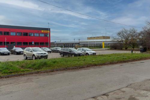 a group of cars parked in a parking lot at Air Apartment 104 in Vilnius