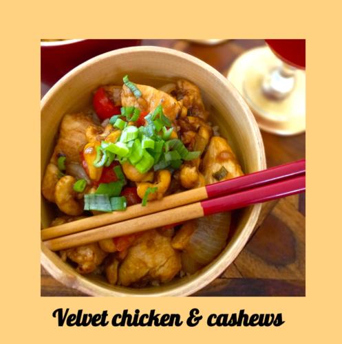 a bowl of tofu chicken and vegetables with chopsticks at Linden Lodge Stays in Saint-Claud
