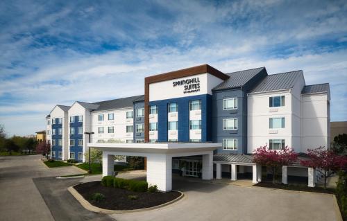 a large white building with a sign on it at SpringHill Suites Kansas City Overland Park in Overland Park