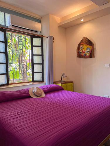 Una cama o camas en una habitación de Hostel Candelaria