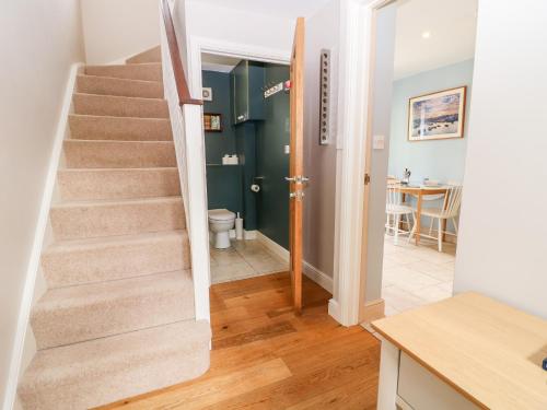 a stairway in a home with a bathroom at 3 Painters Field in Cirencester