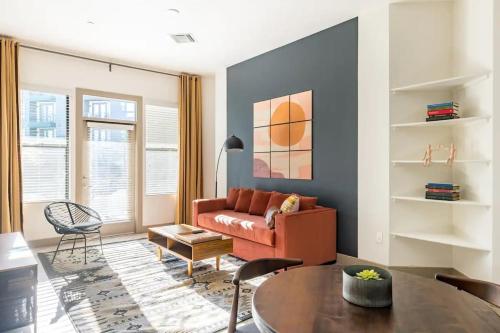 a living room with a couch and a table at Modern 2BR CozySuites Town Lake Waterfront! in Tempe