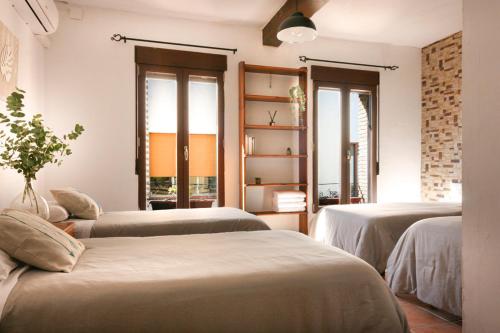 Postel nebo postele na pokoji v ubytování Casa Tàrbena