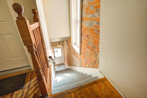 a staircase with a window and a brick wall at St George Suites by Hoco Hotels Collection in Stratford