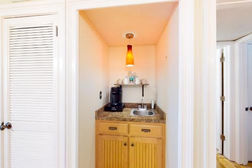 a small kitchen with a sink in a room at Spa on Port Royal Sound 1321 in Hilton Head Island