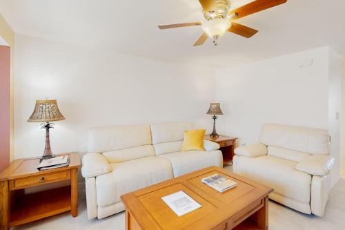 a living room with a couch and a table at Dune Our Thing in Rotonda West