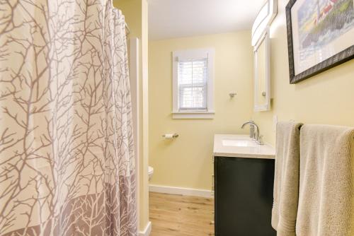een badkamer met een douchegordijn en een wastafel bij Family-Friendly Bridgton Home, Steps to Lake! in Bridgton