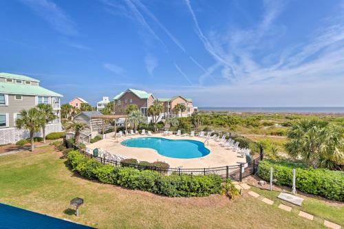 an aerial view of a swimming pool at a resort at Pool Access and Views at Saint Helena Island Condo! in Oceanmarsh Subdivision