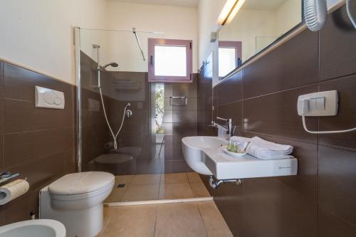 Koupelna v ubytování Corte dei Melograni Hotel Resort