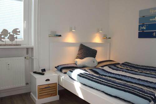 Postel nebo postele na pokoji v ubytování Ferienwohnung-Meeresrauschen