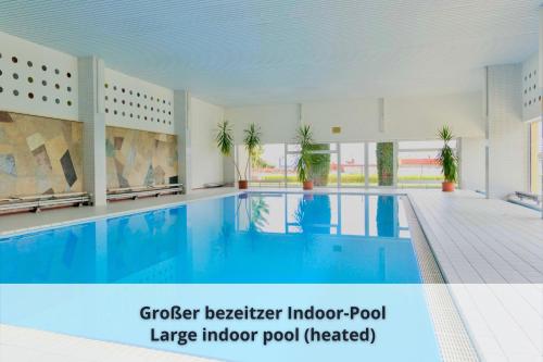 a large indoor pool with a large indoor pool needed at Auszeit Apartment ALPENBLICK in Oberteuringen