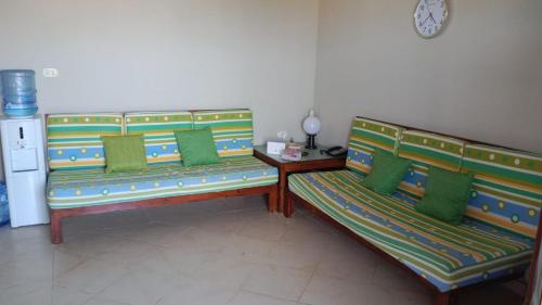 En eller flere senger på et rom på Coastal Escape - Ballah Resort