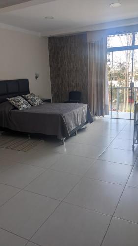 Ein Bett oder Betten in einem Zimmer der Unterkunft Moderno Departamento Céntrico c/ Wifi Empresarial