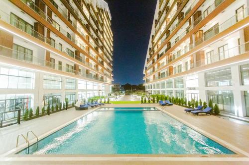 a swimming pool in the middle of a building at Accra Luxury Apartments @ The Signature in Accra