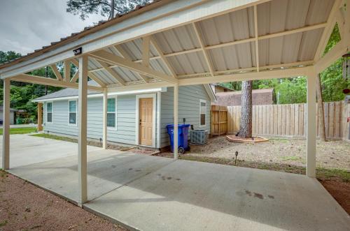 a covered patio in front of a house at Lake Conroe Vacation Rental half Mi to Boat Launch! in Willis