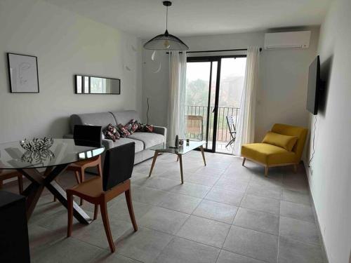 a living room with a couch and a table at Appartement de standing piana in Piana