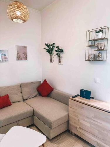 a living room with a couch and a table at Paradise House in Arkoudi