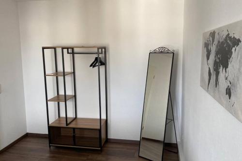 a mirror and a mirror stand in a room at Wunderschöne großzügige Neustadtwohnung in Dresden
